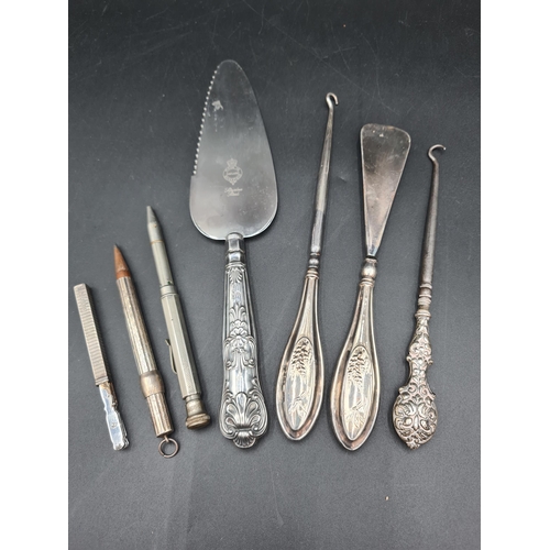 105 - A Travelling Manicure Set in silver case, Chester 1929, two Propelling Pencils, two Button Hooks, Sh... 