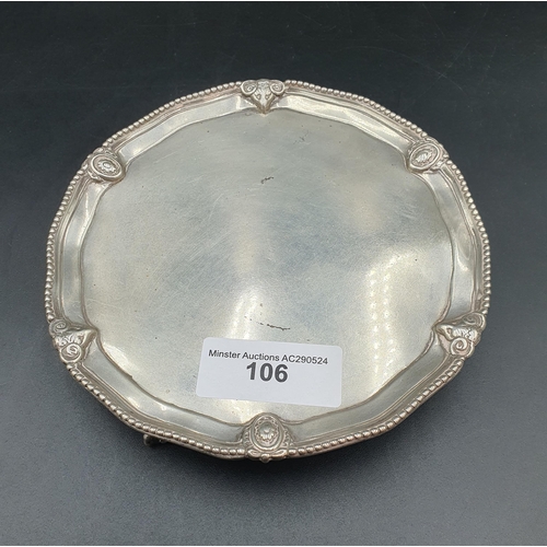 106 - A George III silver circular Card Tray with beaded and ram's head mask border on three ball and claw... 