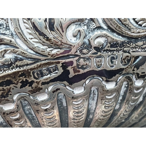 107 - A Victorian silver Bowl with floral and leafage scroll embossing, London 1882, A/F on plinth