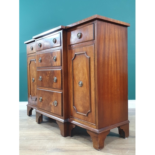 11 - A reproduction mahogany veneered Breakfront Sideboard fitted six drawers and pair of cupboard doors ... 