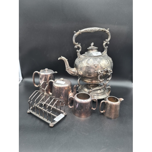 111 - An E.P.B.M Kettle on Stand, plated four piece Tea Service and a Toastrack (R3)