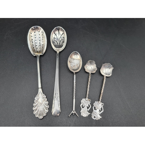 114 - An American Straining Spoon by Braverman & Levy, a sterling Straining Spoon, a Souvenir Spoon, Chest... 