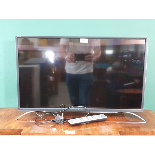 12 - A Sharp 32in Smart TV with control, passed PAT  (R6)