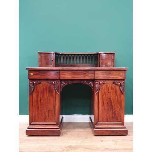 13 - A Victorian mahogany Pedestal Desk with raised back fitted two cupboard doors above base fitted thre... 