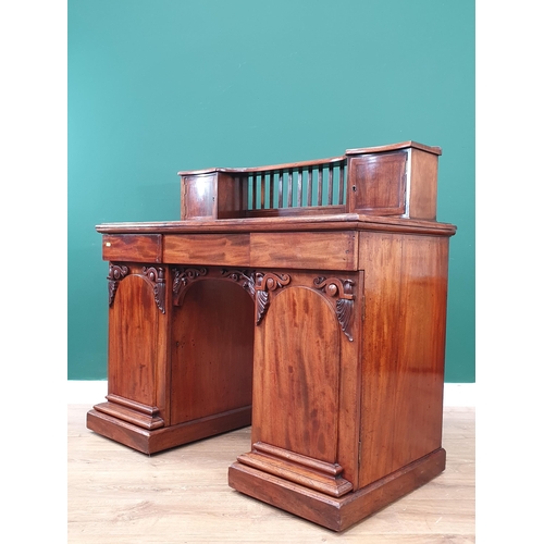 13 - A Victorian mahogany Pedestal Desk with raised back fitted two cupboard doors above base fitted thre... 