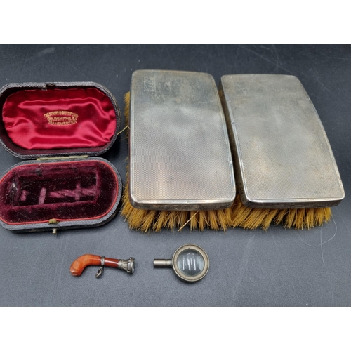 135 - A pair of George V silver mounted Brushes, Birmingham 1934, and a Box containing pistol grip hardsto... 