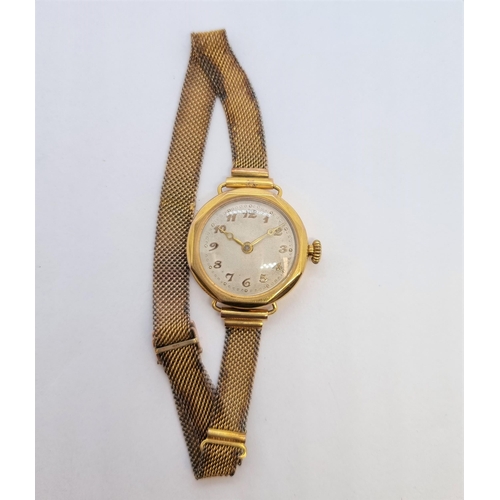 159 - A lady's 9ct gold cased Wristwatch the circular with gold arabic numerals and hands, octagonal bezel... 