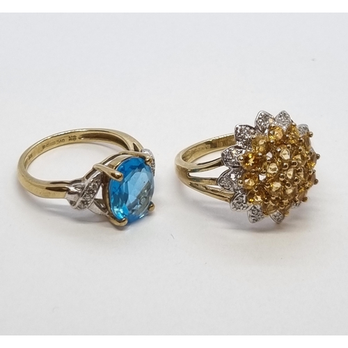 165 - A Topaz and Diamond Ring claw-set oval mixed cut blue topaz with single cut diamonds to shoulders in... 