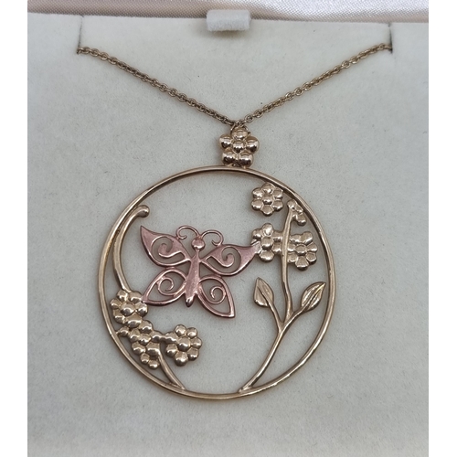 174 - A Clogau Gold Pendant comprising a circular open wire work 9ct yellow gold floral decoration and a r... 