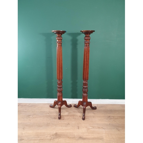 19 - A pair of mahogany Torcheres on fluted columns and tripod bases 4ft 7in H (R6)