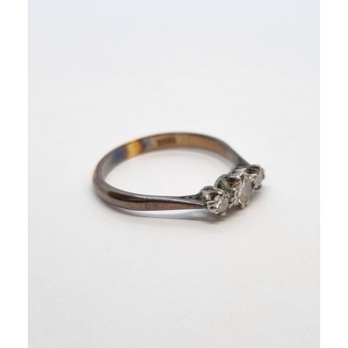 192 - A Diamond three stone Ring claw-set graduated brilliant-cut stones, stamped 18ct, ring size N, appro... 