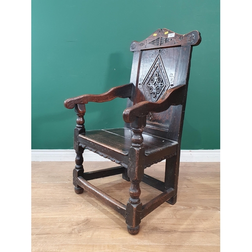 21 - A 17th Century and later joined oak Armchair with diamond carved panel back raised on turned support... 