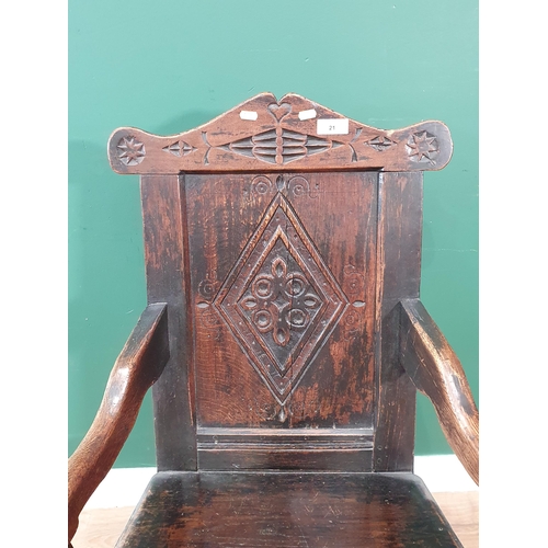 21 - A 17th Century and later joined oak Armchair with diamond carved panel back raised on turned support... 