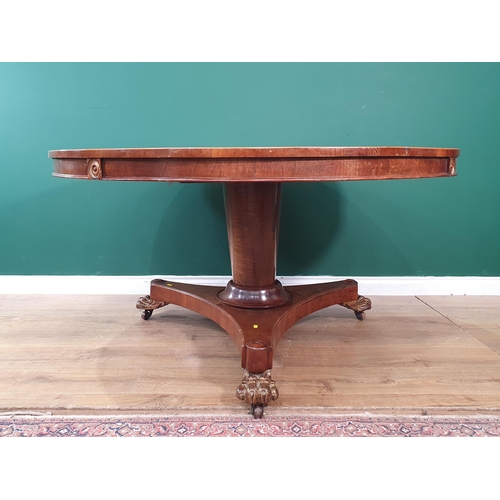 23 - A reproduction sectional mahogany veneered Centre Table raised on tripod concave base with three paw... 