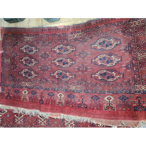 242 - Three small antique woollen red ground Rugs 2x 4ft 8in L x 2ft 6in W and the other 4ft 10in L x 2ft ... 