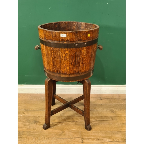 250 - A coopered oak two handled Jardiniere on stand, 2ft 7in H A/F (R7)