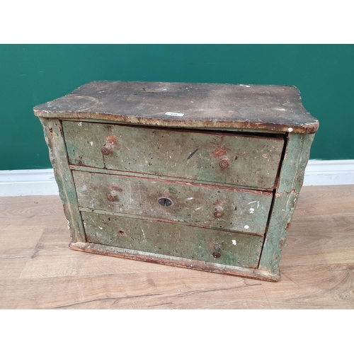 278 - A green painted pine Bank of three long Drawers with shaped top, and applied bamboo style decoration... 