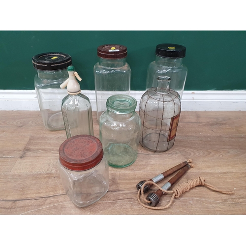 285 - Three vintage glass Sweet Jars, an apothecary Bottle with later label, a Britvic Soda Water Bottle, ... 