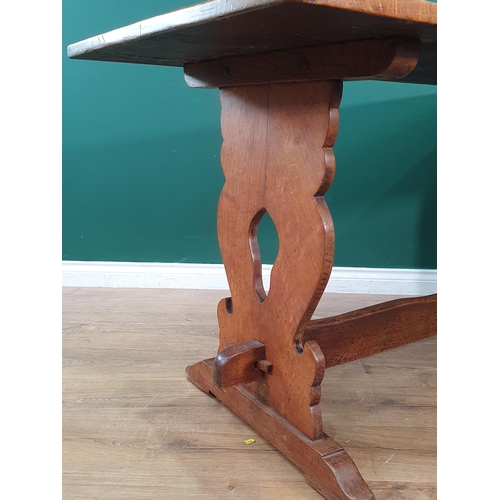 29 - An oak Refectory Table on shaped end supports 5ft L x 2ft 7in H (R7)