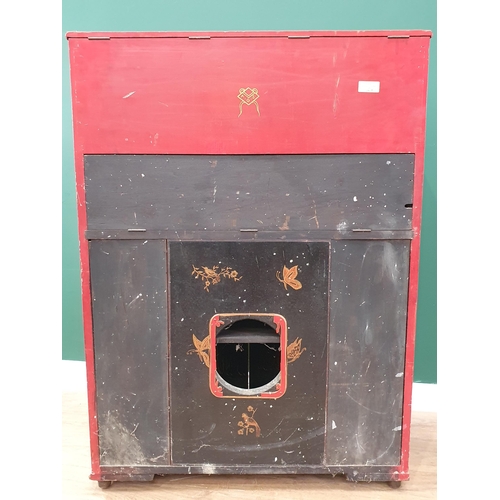 295 - A 20th Century red lacquered oriental Music Cabinet with lift up top, fall front compartment above p... 