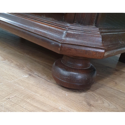 297 - A reproduction oak Chest of of three long Drawers raised on large turned bun feet, 2ft 8