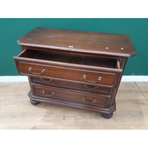 297 - A reproduction oak Chest of of three long Drawers raised on large turned bun feet, 2ft 8