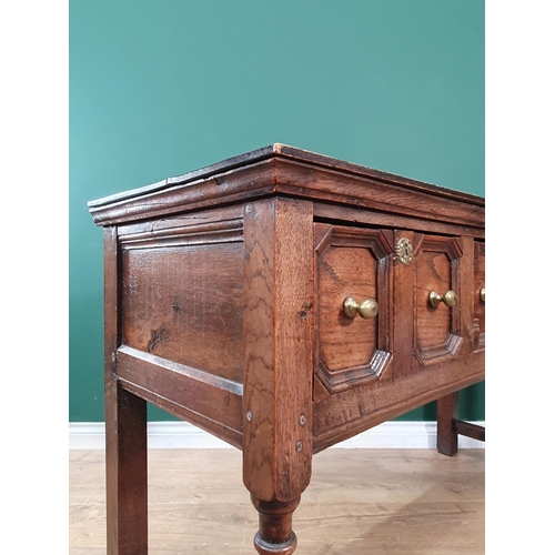 30 - An oak Dresser Base in the 17th Century style fitted three moulded drawers raised on turned supports... 