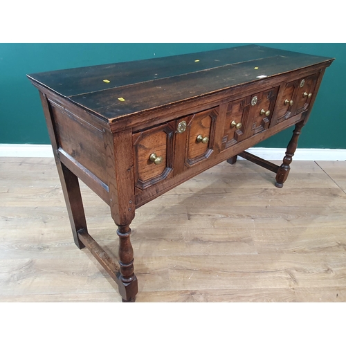 30 - An oak Dresser Base in the 17th Century style fitted three moulded drawers raised on turned supports... 