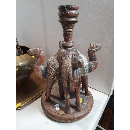 301 - A collection of Eastern items including a pair of Candlesticks, the supports in the form of camels, ... 