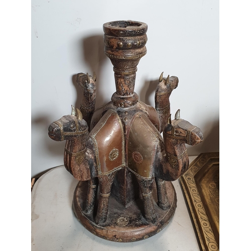 301 - A collection of Eastern items including a pair of Candlesticks, the supports in the form of camels, ... 