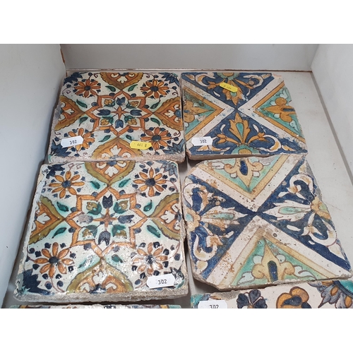 302 - Ten Isnik type pottery Tiles decorated flowers and scrolls in coloured enamels, 6in square to 5in sq... 