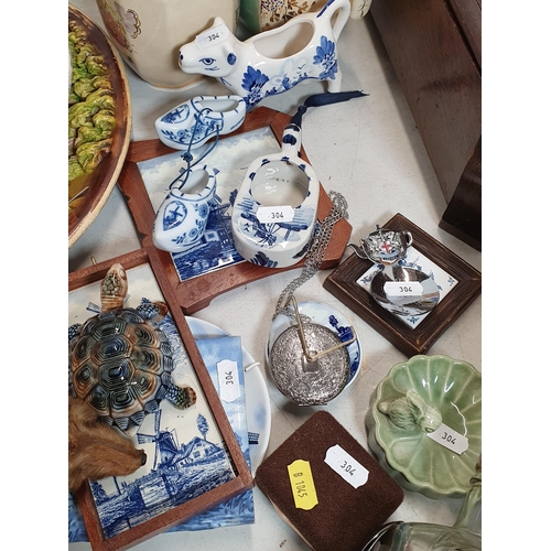 304 - Five relief moulded pottery Plaques, two Jugs, modern Delft items, a Wade Tortoise Box and Cover, Sh... 