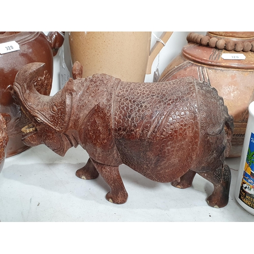 320 - A carved wood Figure of a Rhinocerous, 9in, leg A/F, a Moorcroft seconds Box and Cover, 5in, a salt-... 