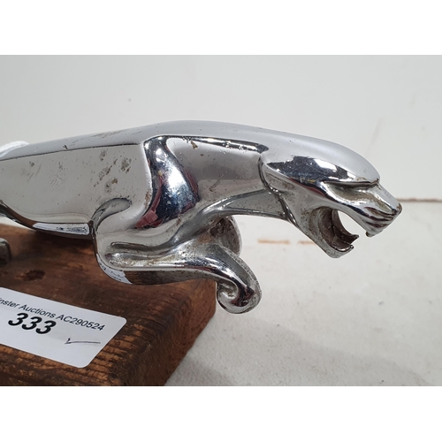 333 - A chrome-plated Jaguar Car Mascot on wooden plinth, 7 1/2in (R5)