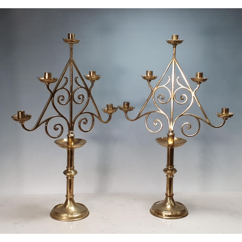 348 - A pair of brass Church Candlesticks, five lights on column with domed bases, 2ft 1in H