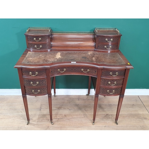 44 - A 19th Century mahogany Desk in the Chippendale style fitted eleven drawers with blind fret carving ... 