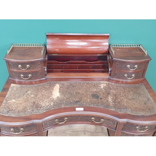 44 - A 19th Century mahogany Desk in the Chippendale style fitted eleven drawers with blind fret carving ... 