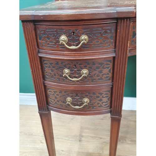 44 - A 19th Century mahogany Desk in the Chippendale style fitted eleven drawers with blind fret carving ... 