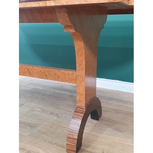 47 - An Art Deco birds-eye maple veneered and rosewood crossbanded Dining Table on arched end supports 6f... 