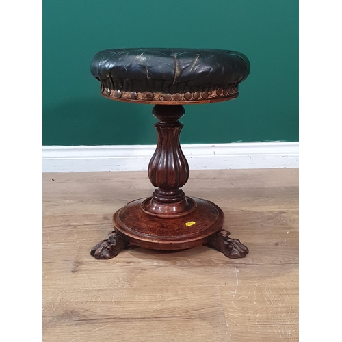 50 - An antique circular Piano Stool with leather button-upholstered seat on turned column support, paw f... 