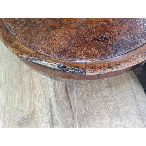 50 - An antique circular Piano Stool with leather button-upholstered seat on turned column support, paw f... 