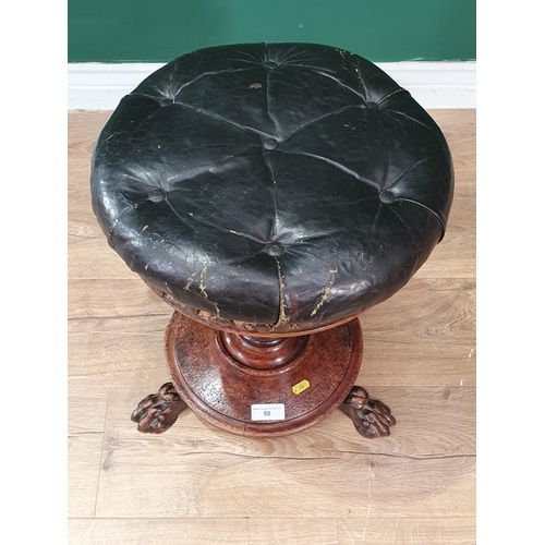 50 - An antique circular Piano Stool with leather button-upholstered seat on turned column support, paw f... 