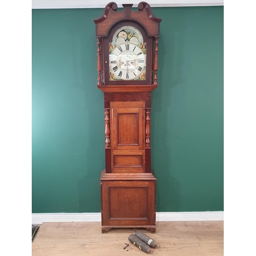 597 - A 19th Century oak and mahogany Longcase Clock, the painted arched dial with simulated moon phase, a... 