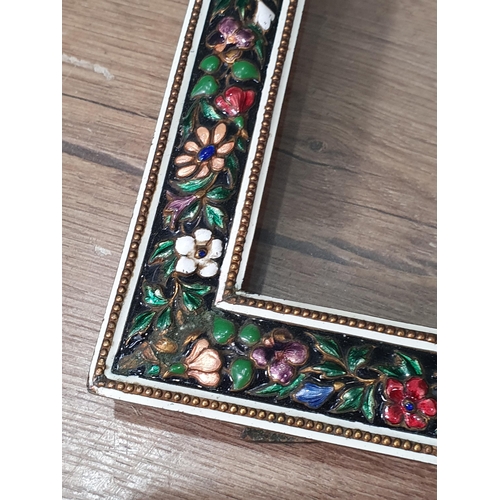 61 - An enamel decorated easel Photograph Frame with multi coloured floral decorations, a gilt metal Phot... 