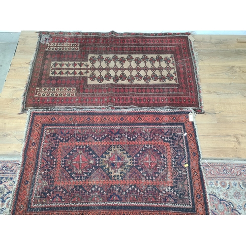 65 - A Persian red ground Prayer Rug 4ft 10in L x 2ft 10in W A/F and another small red ground Rug with th... 