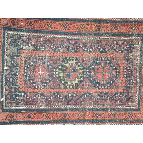 65 - A Persian red ground Prayer Rug 4ft 10in L x 2ft 10in W A/F and another small red ground Rug with th... 