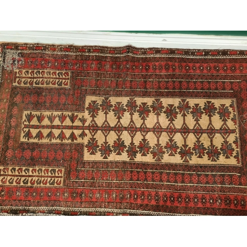 65 - A Persian red ground Prayer Rug 4ft 10in L x 2ft 10in W A/F and another small red ground Rug with th... 