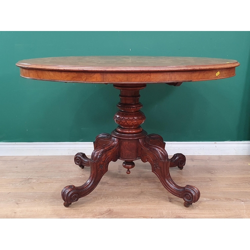 7 - A Victorian walnut veneered oval Loo Table on quadruple splayed base with scroll feet and casters 3f... 