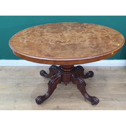 7 - A Victorian walnut veneered oval Loo Table on quadruple splayed base with scroll feet and casters 3f... 