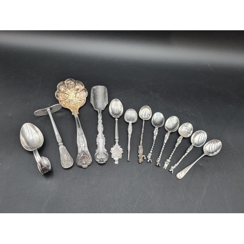 75 - A sterling silver Cheese Scoop, six Continental silver Spoons, isle of Man Souvenir Spoon, Coffee Sp... 